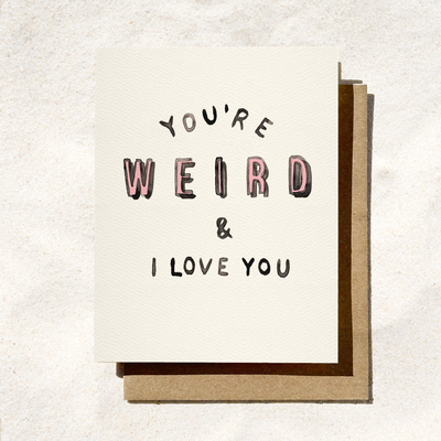 Card with text 'You're Weird & I Love You' on a textured white background
