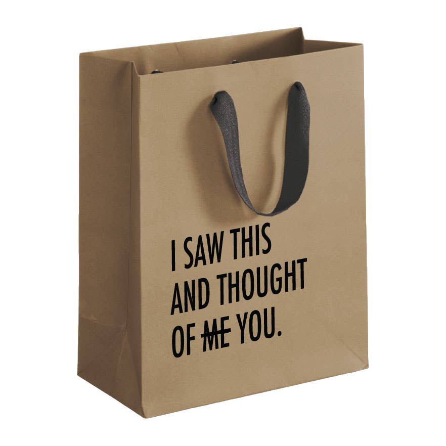 Brown paper bag with black text 'I saw this and thought of me you' on a white background