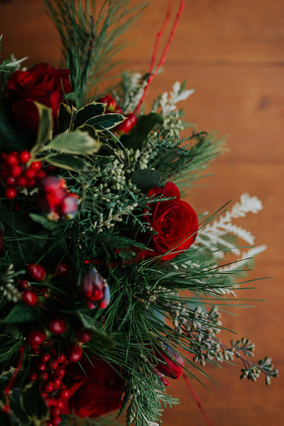 red and green christmas flower centerpiece